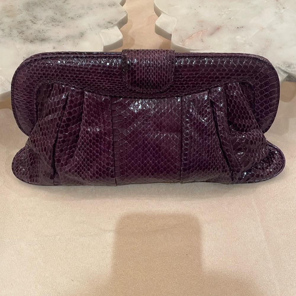 Purple state, snake skin clutch